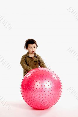 Little boy with big oink ball