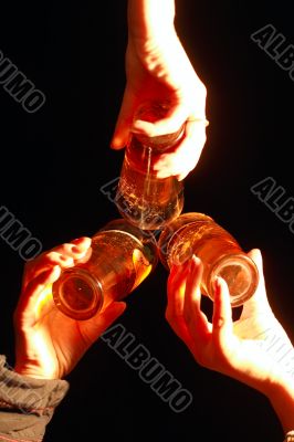 three glass with beer in women hands