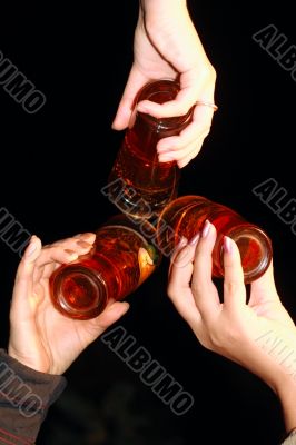 three glass with beer in women hands