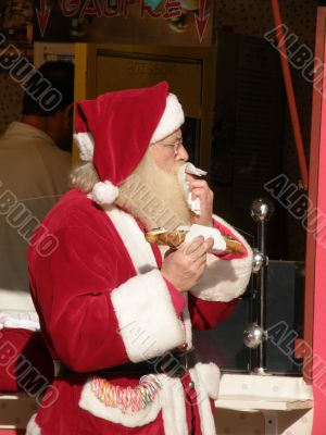 Santa eating a sandwich