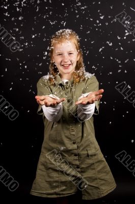 little girl is enjoying the snow