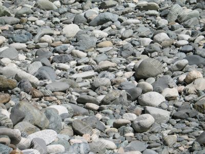 a gray pile of rounded rocks