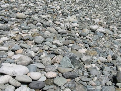 a gray pile of rounded rocks