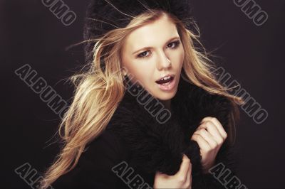 Woman in black fur hat and coat