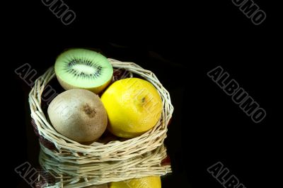 Lemon, kiwi and basket.
