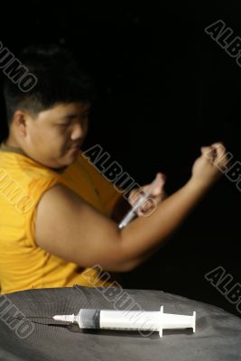 Chinese man injecting himself