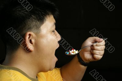 Man eating pills