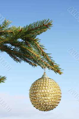 christmas bauble on green tree