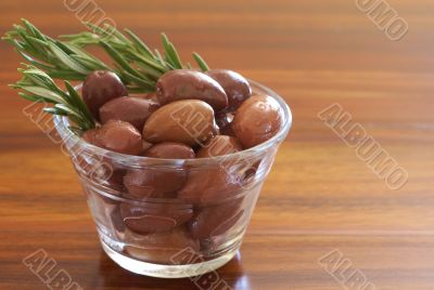 Single jar of black kalamata olives and rosemary