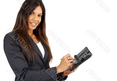 Beautiful brunette businesswoman holding a diary