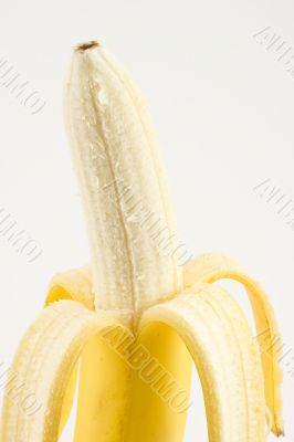 One cleared banana on light background