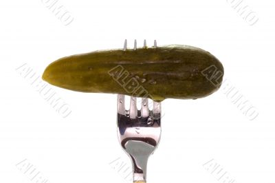 Salt cucumber on the fork