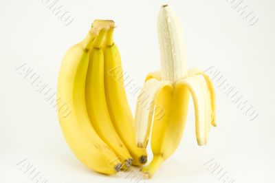 Four bananas on light background