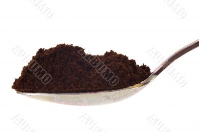 Spoon with ground cofee