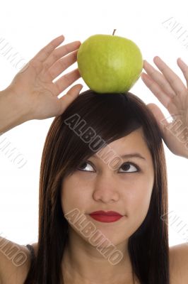 Teenager with apple at the head