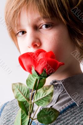 Young boy with a rose