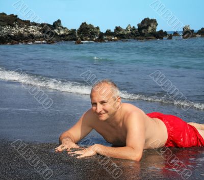 Man on Black sand beach