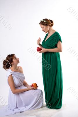 Two ladies and two apples
