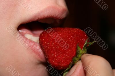 Mouth eat big mature strawberry