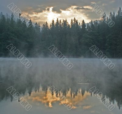 Sunrise on mountain lake