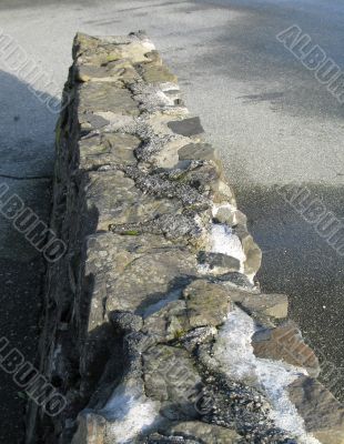 an old gray stone wall