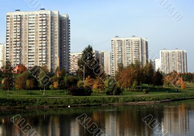 The houses on the river bank with reflection