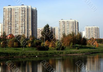 The houses on the river bank with reflection