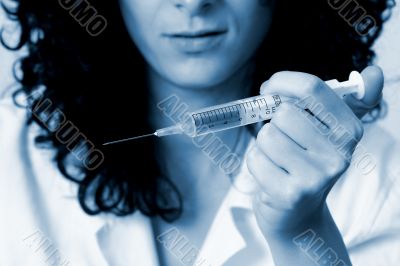 Portrait of a young doctor with syringa.