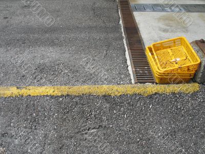 yellow trays in a parking lot