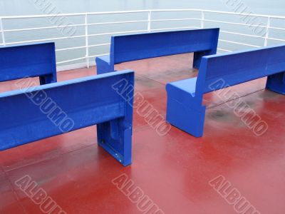 blue benches on red floor