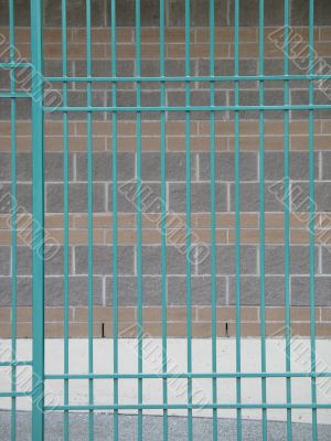 green fence protecting shopping carts