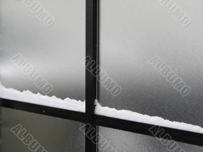 snow on a window frame