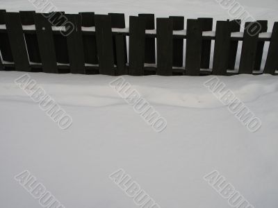 wooden fence with snow
