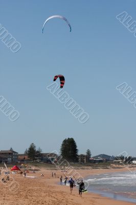 Kite Surfers On A Beach