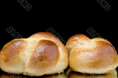 fresh small loaf on black macro