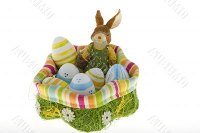 Easter bunny in the nest with eggs