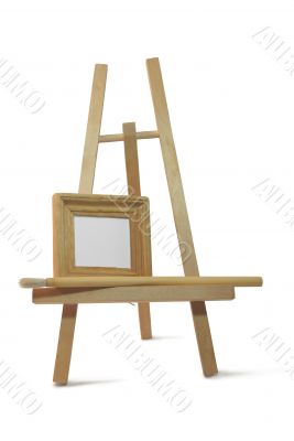 small wooden empty frame on easel