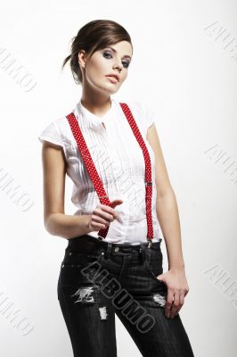 Photo of beautiful girl stretching suspenders
