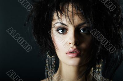 brunette girl posing on dark background