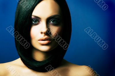 brunette girl posing on dark background