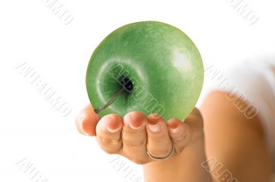 Green apple and hand