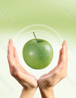 Green apple and hands