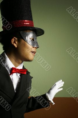 Man in mask and top hat surprise pose