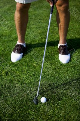 male golfer on putting green