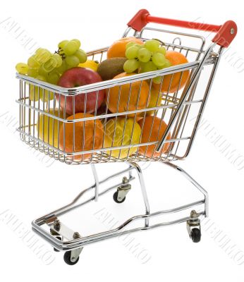 Shopping trolley with fruits, supermarket