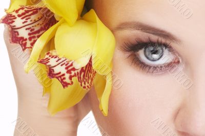 happy young woman with yellow flower