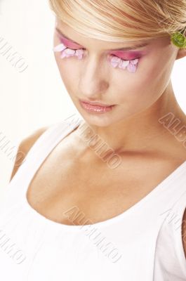 Girl wearing makeup made of flowers