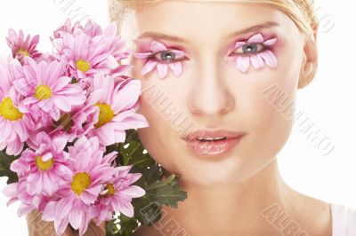 Girl wearing makeup made of flowers