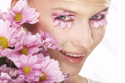 Girl wearing makeup made of flowers