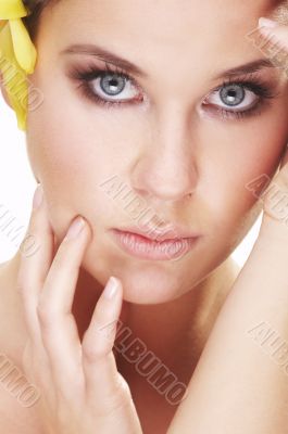 happy young woman with yellow flower
